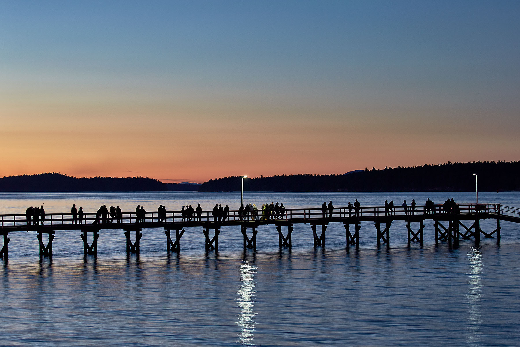 People gather on Fernwood Pier in anticipation of the Lunar Eclipse