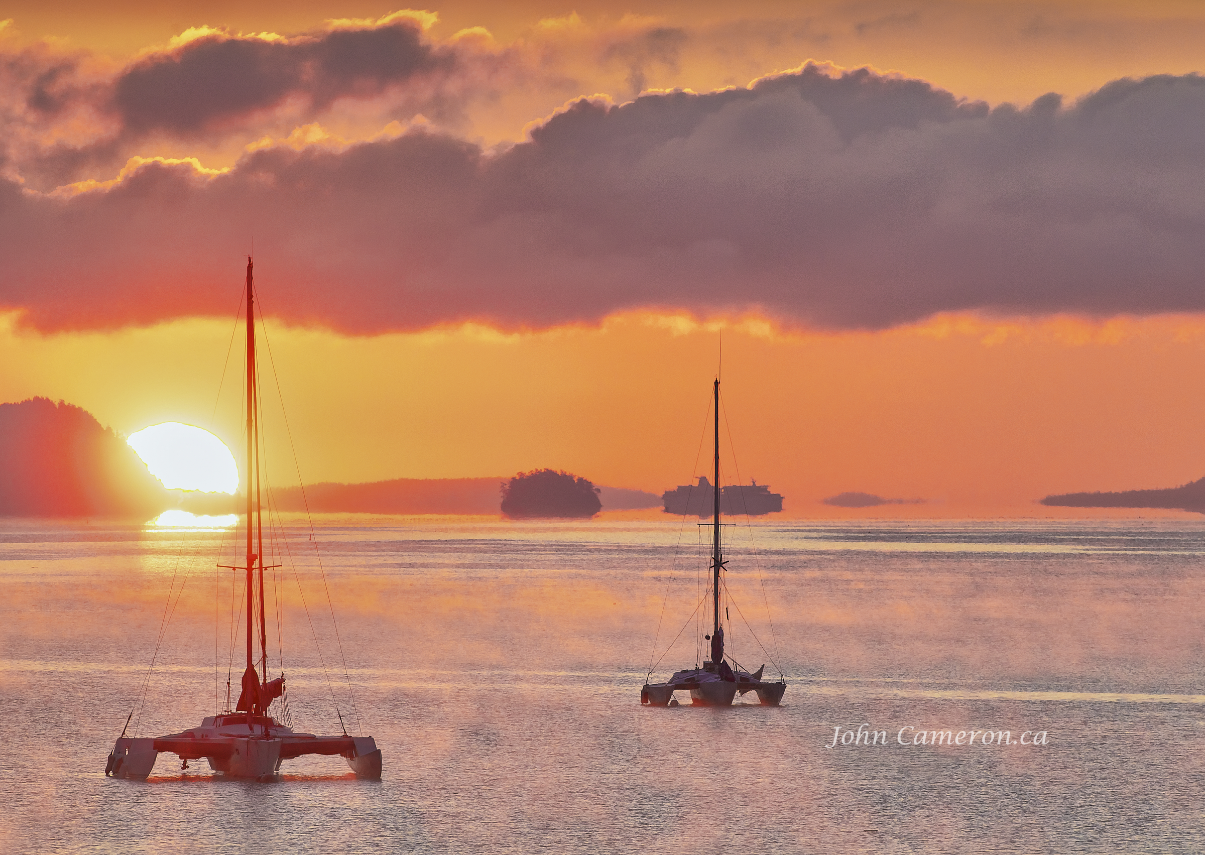 Winter Sunrise with trimaran sailboats ©johncameron.ca