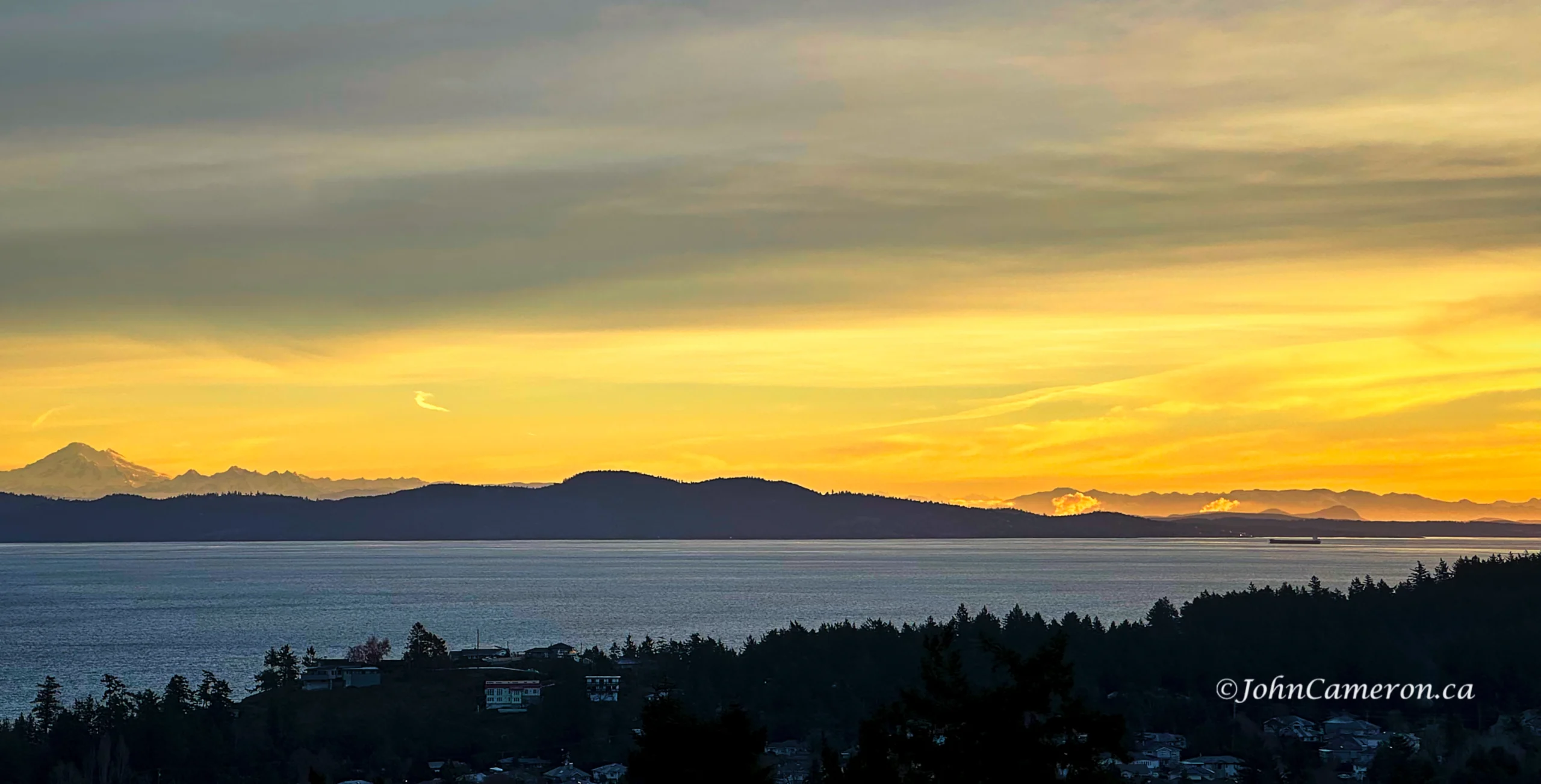 Baker and the Cascades, Haro Strait, freighter, and the Olympic Mountains. ©johncameron.ca