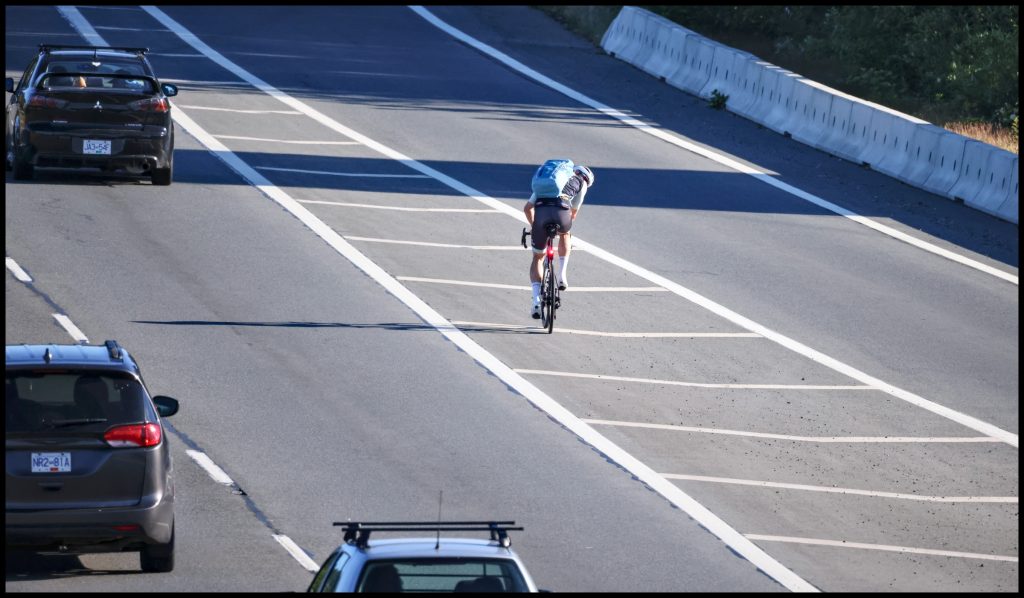 Bike merging in rush hour traffic ©johncameron.ca